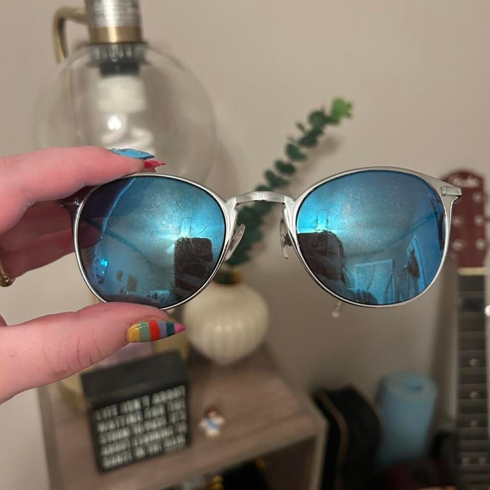 Silver round sunglasses with blue mirrored lenses